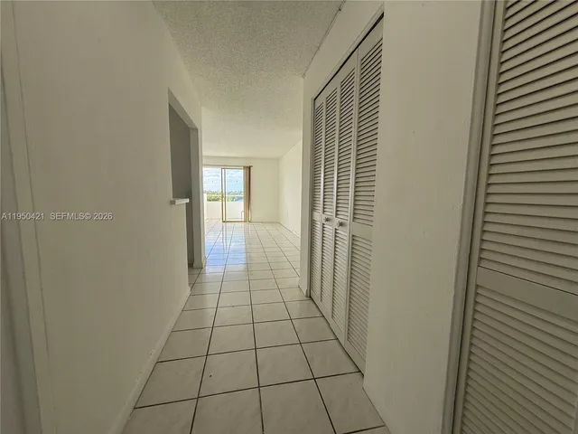 a kitchen with stainless steel appliances white cabinets and a stove