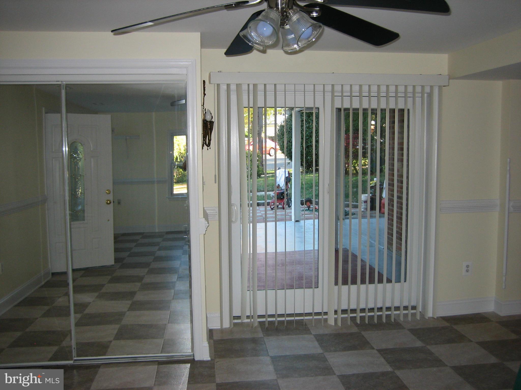 6339 Beryl Road Alexandria, VA 22312 - Photo 22 of 28 a view of a hallway with wooden door