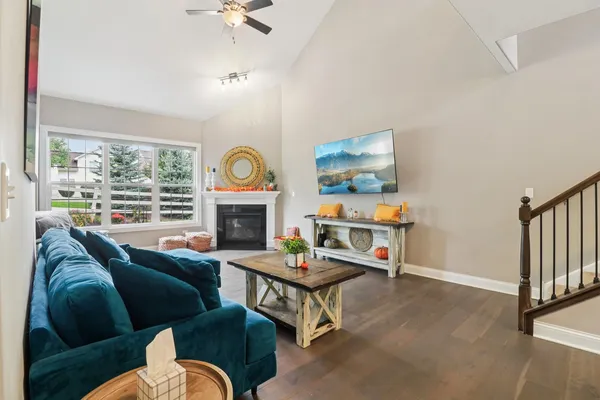 a living room with furniture fireplace and window