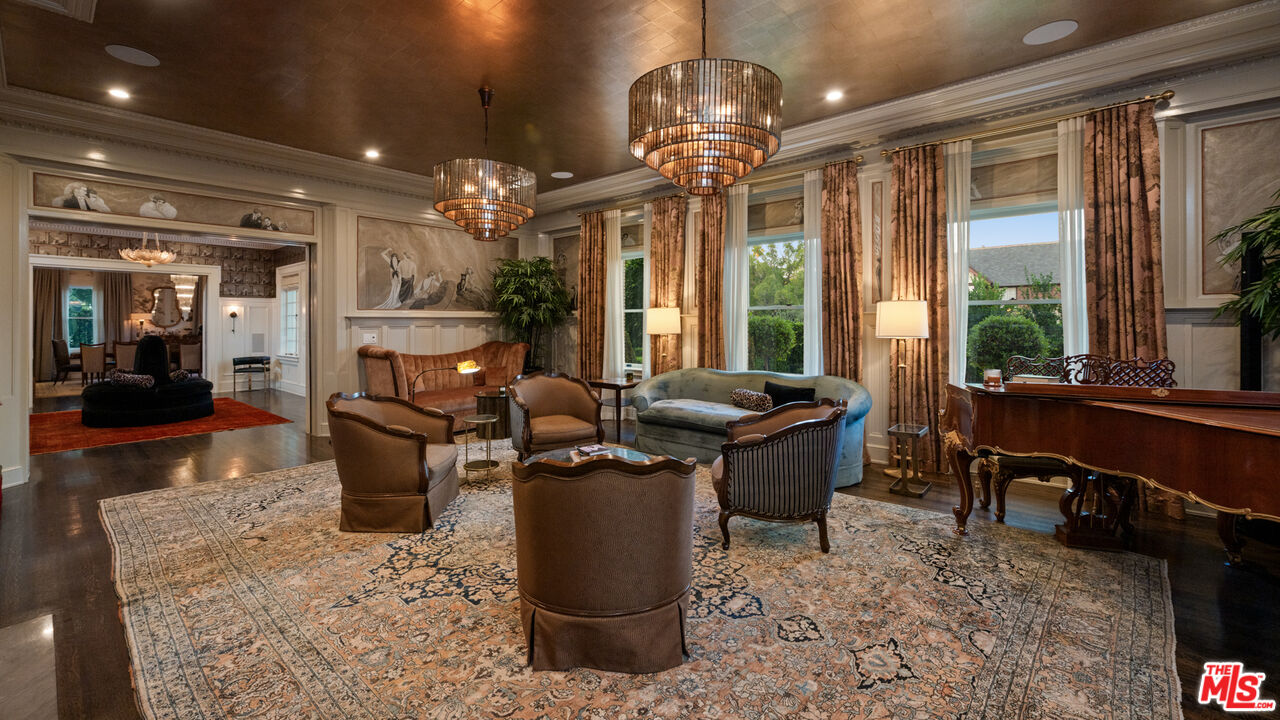 601 South Windsor Boulevard Los Angeles, CA 90005 - Photo 13 of 48 a view of a dining room with furniture a chandelier and wooden floor