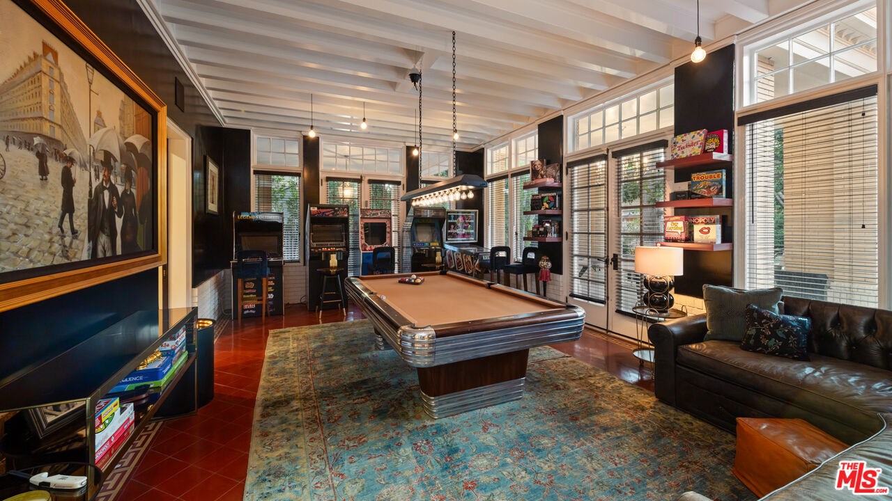 601 South Windsor Boulevard Los Angeles, CA 90005 - Photo 14 of 48 a living room with lots of furniture and a flat screen tv