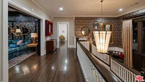 a view of a entryway door of the house and wooden floor