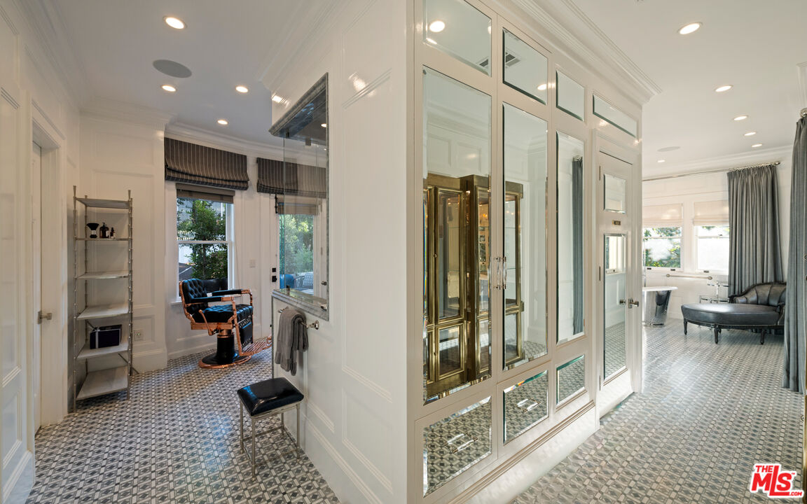 601 South Windsor Boulevard Los Angeles, CA 90005 - Photo 27 of 48 a view of a hallway with living room and furniture