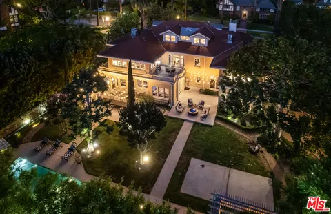 a view of a house with a backyard porch and sitting area