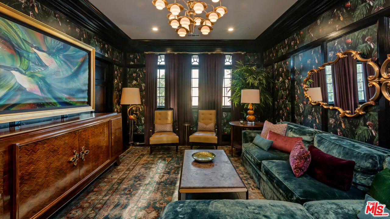 601 South Windsor Boulevard Los Angeles, CA 90005 - Photo 6 of 48 a living room with patio furniture and a floor to ceiling window