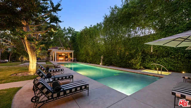 a view of a backyard with sitting area