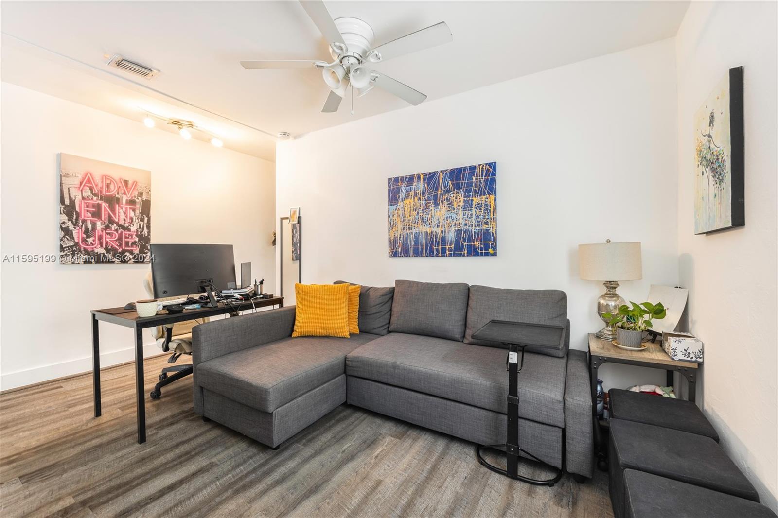 4420 Northwest 3rd Avenue Miami, FL 33127 - Photo 14 of 36 a living room with furniture and a flat screen tv