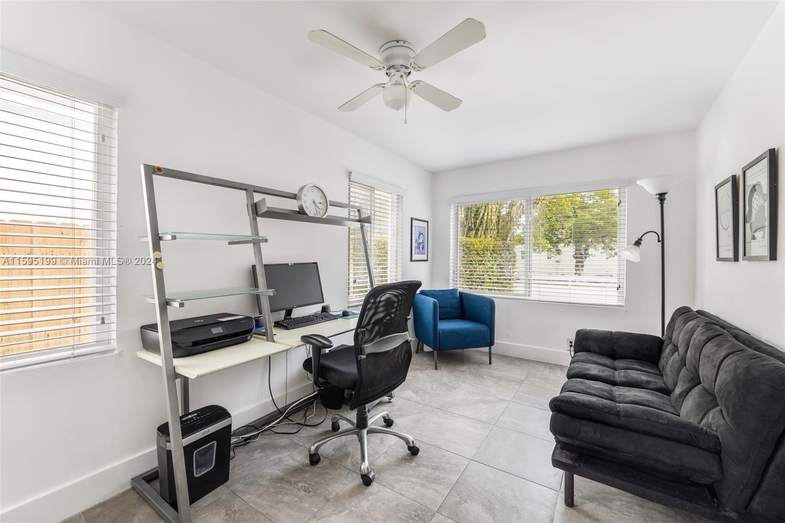 4420 Northwest 3rd Avenue Miami, FL 33127 - Photo 16 of 36 a livingroom with workspace window and a couch