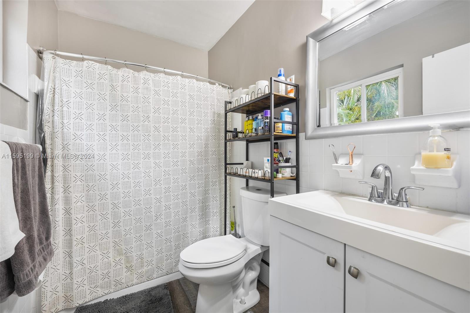 4420 Northwest 3rd Avenue Miami, FL 33127 - Photo 22 of 36 a bathroom with a sink toilet and shower