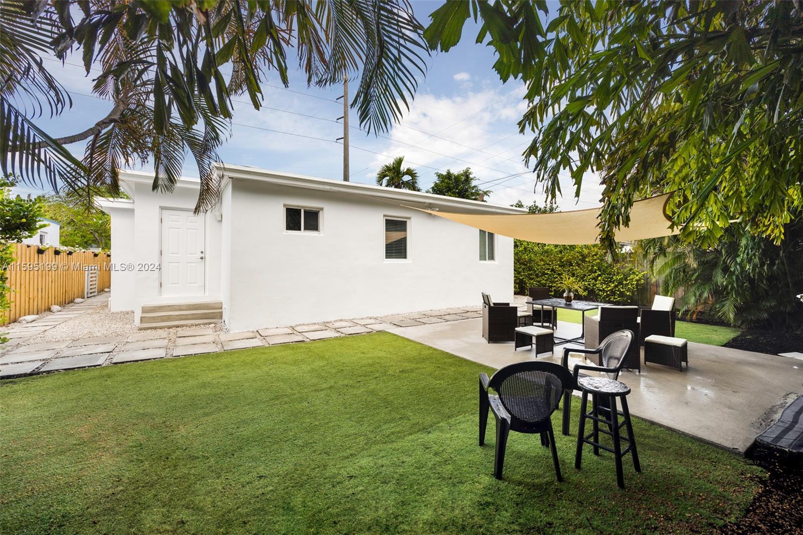 4420 Northwest 3rd Avenue Miami, FL 33127 - Photo 25 of 36 a backyard of a house with table and chairs