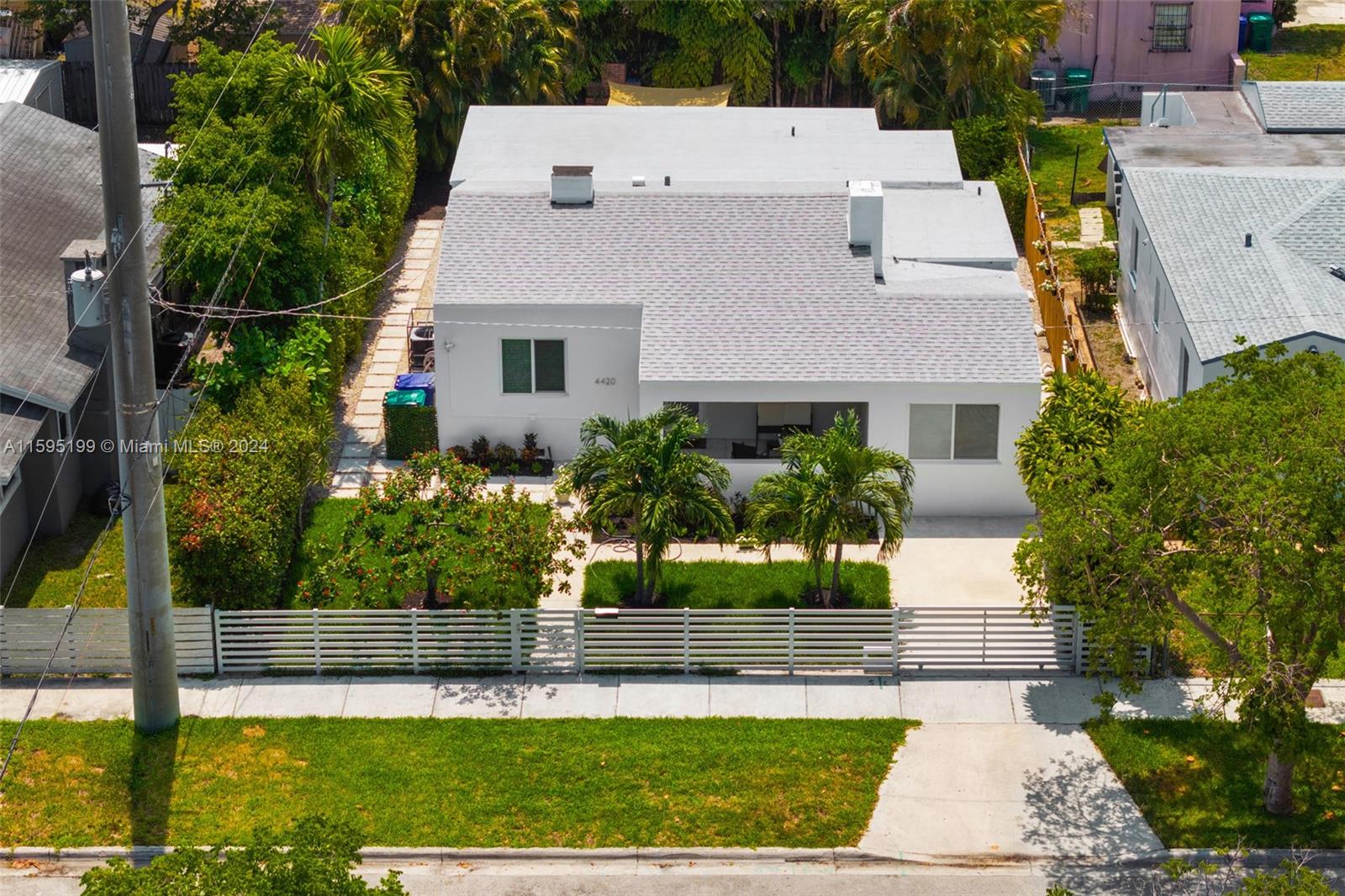 4420 Northwest 3rd Avenue Miami, FL 33127 - Photo 28 of 36 a aerial view of a house with a yard and potted plants