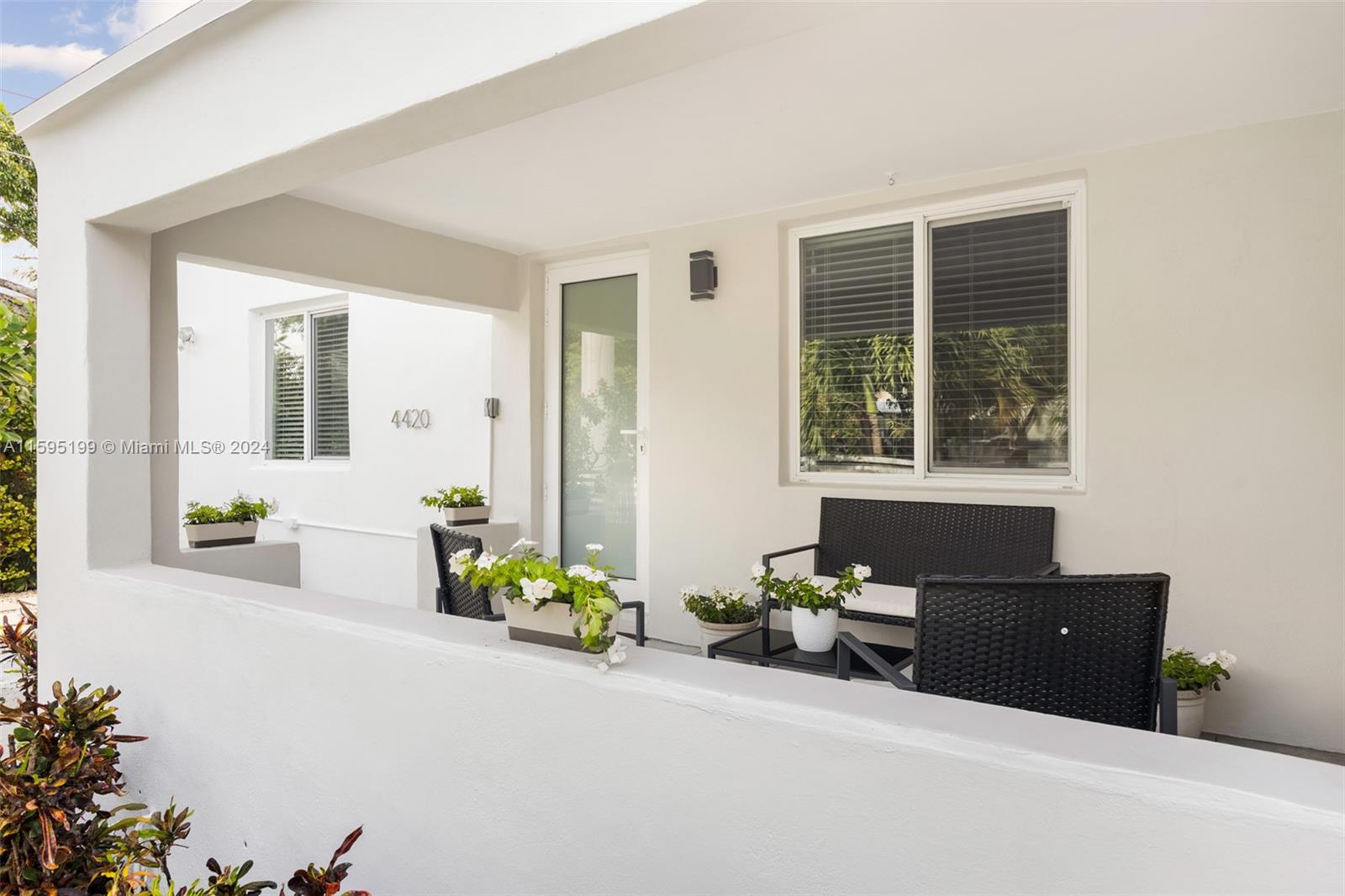 4420 Northwest 3rd Avenue Miami, FL 33127 - Photo 5 of 36 a living room with a couch and a potted plant