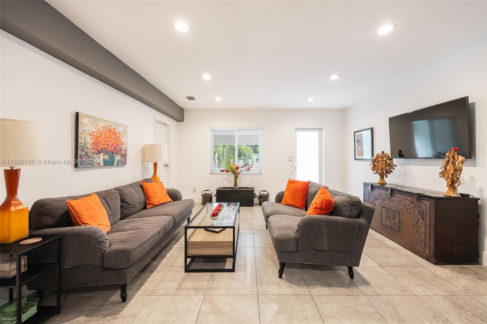 4420 Northwest 3rd Avenue Miami, FL 33127 - Photo 6 of 36 a living room with furniture and a flat screen tv