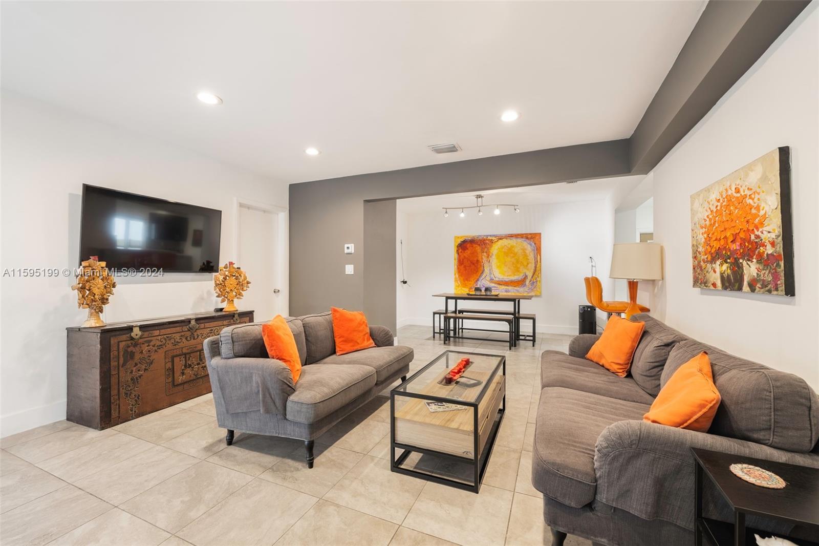 4420 Northwest 3rd Avenue Miami, FL 33127 - Photo 8 of 36 a living room with furniture and a flat screen tv
