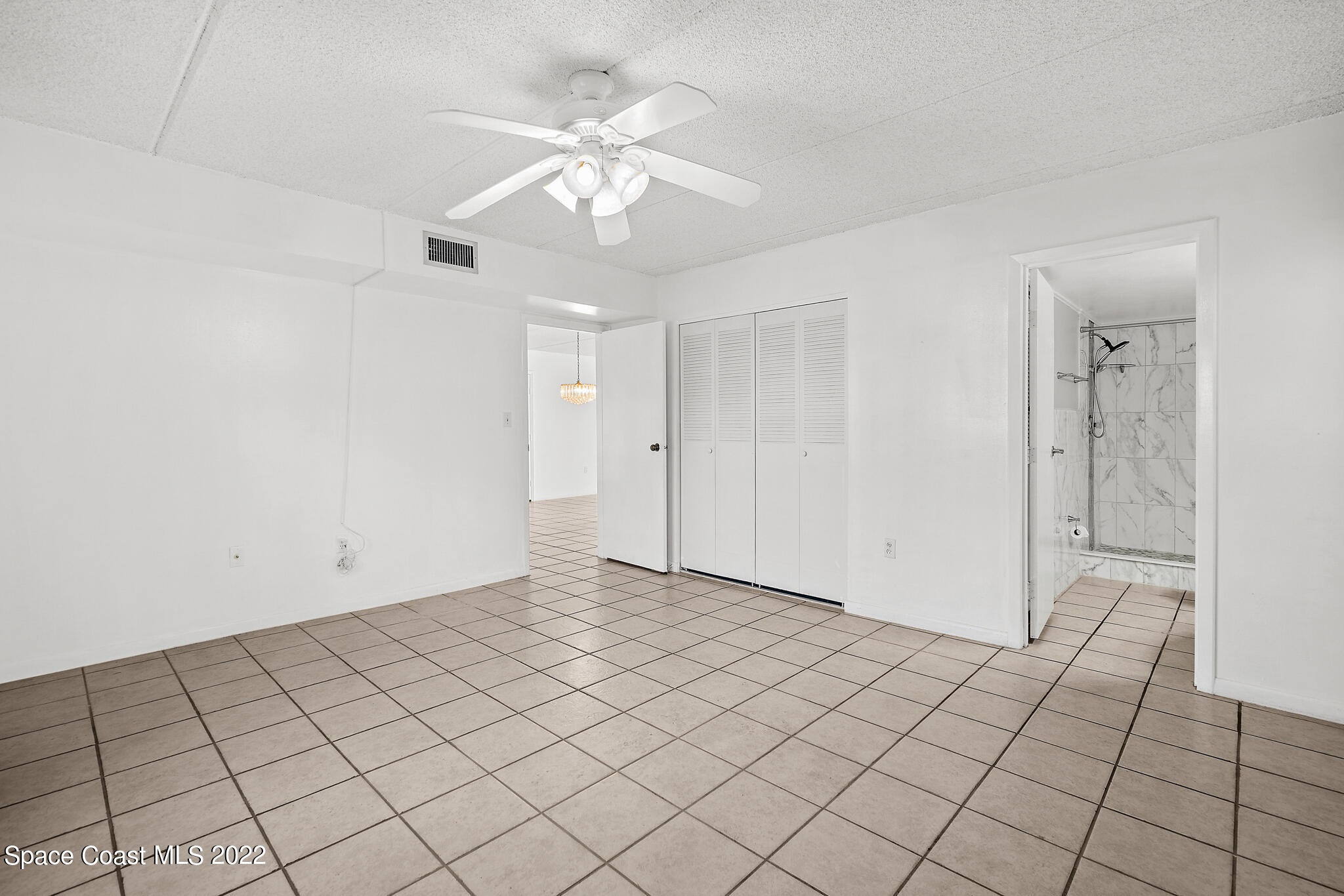 2727 North Wickham Road, Unit 1018 Melbourne, FL 32935 - Photo 9 of 21 Primary Bedroom