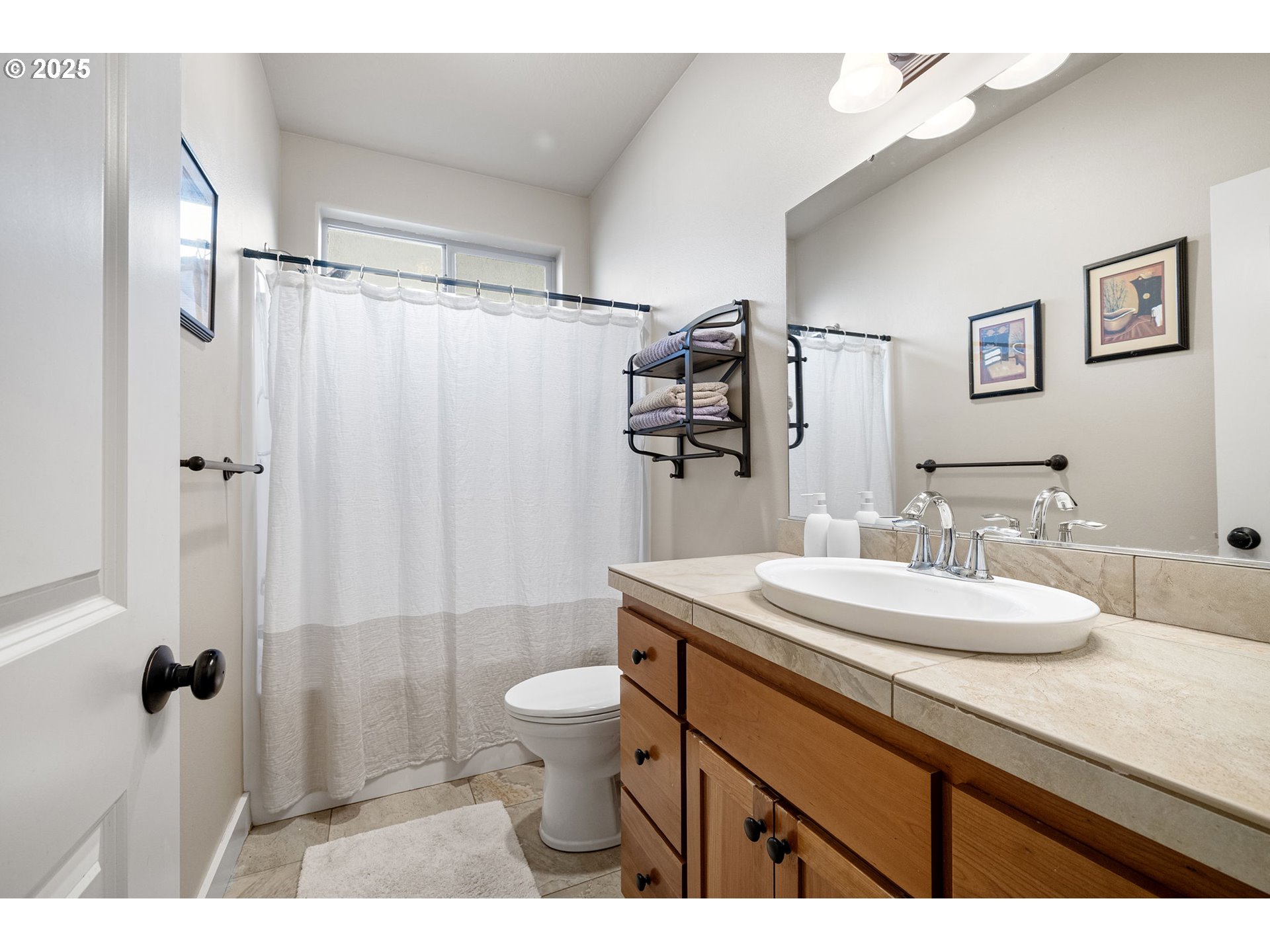 1175 South 40th Place Springfield, OR 97478 - Photo 22 of 34 a bathroom with a sink toilet double vanity and shower