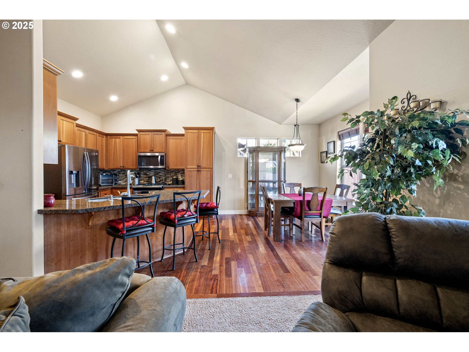 1175 South 40th Place Springfield, OR 97478 - Photo 10 of 34 a living room with lots of furniture and kitchen view