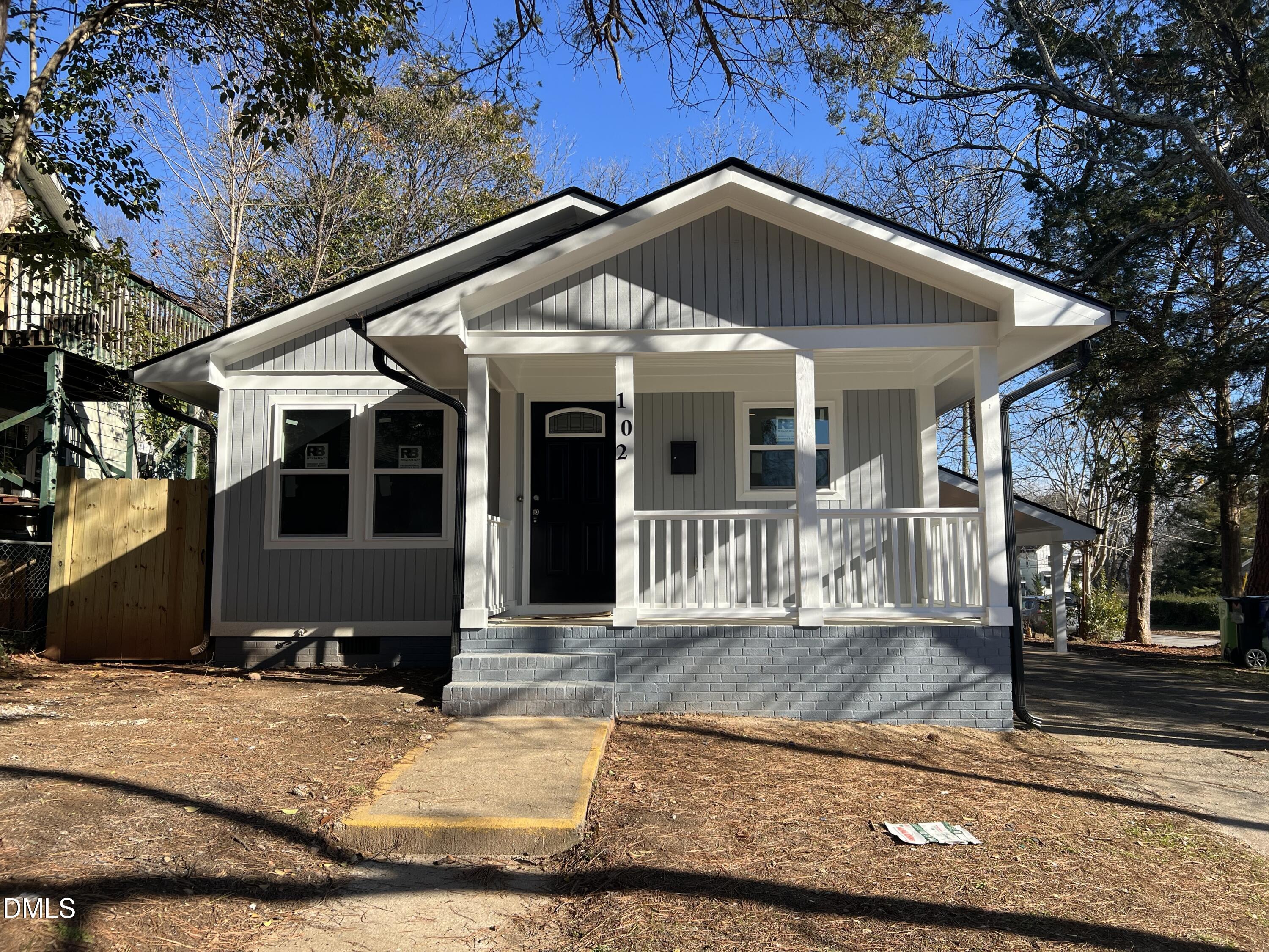 102 St Augustine Raleigh, NC 27610 - Photo 1 of 13 a front view of a house with a yard