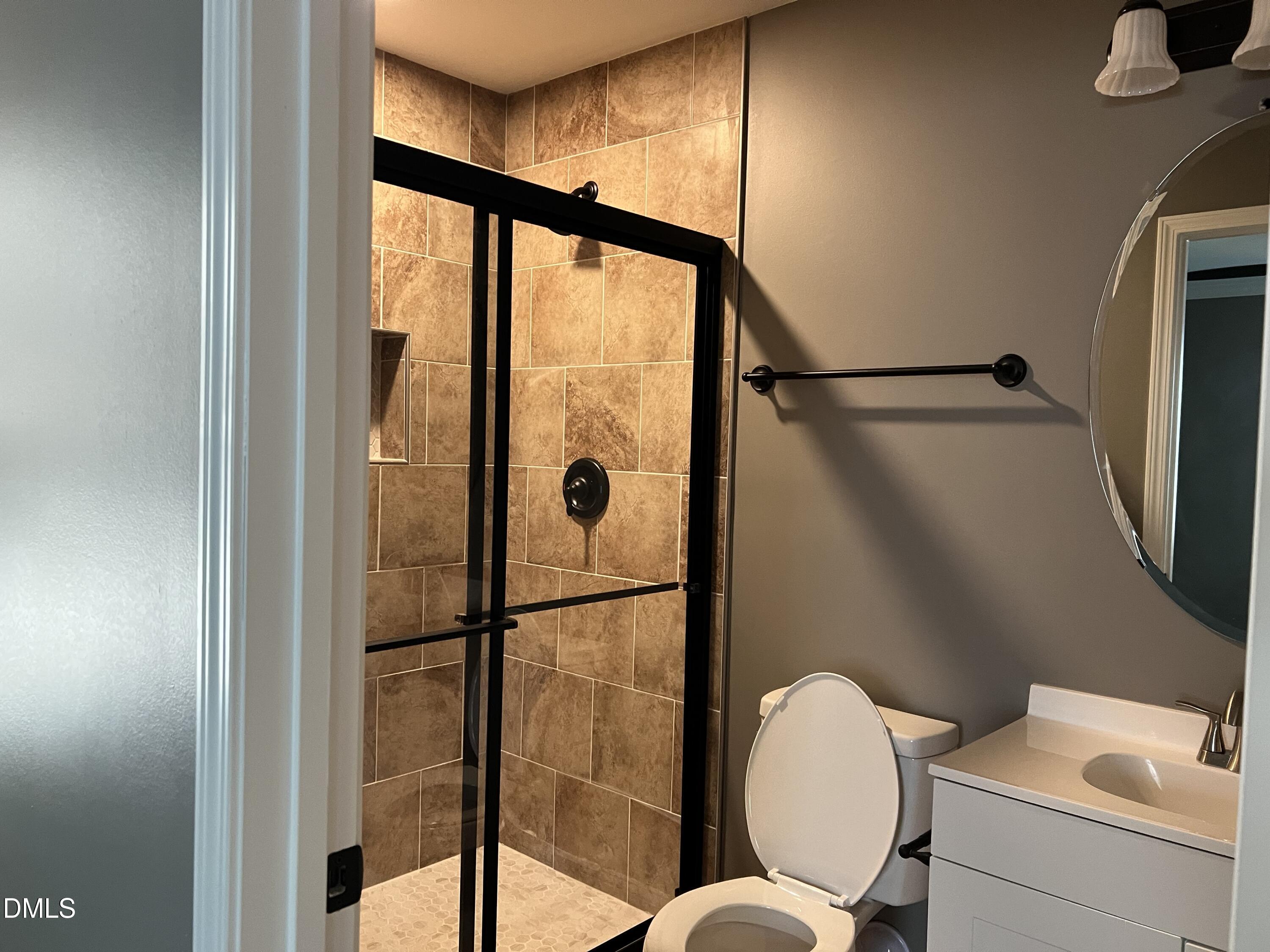 102 St Augustine Raleigh, NC 27610 - Photo 12 of 13 a bathroom with a toilet and a shower