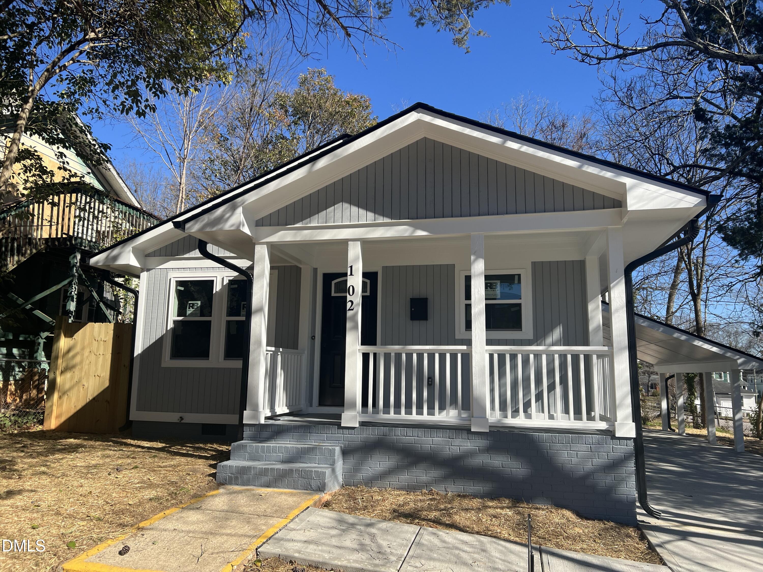 102 St Augustine Raleigh, NC 27610 - Photo 2 of 13 a front view of a house with a yard