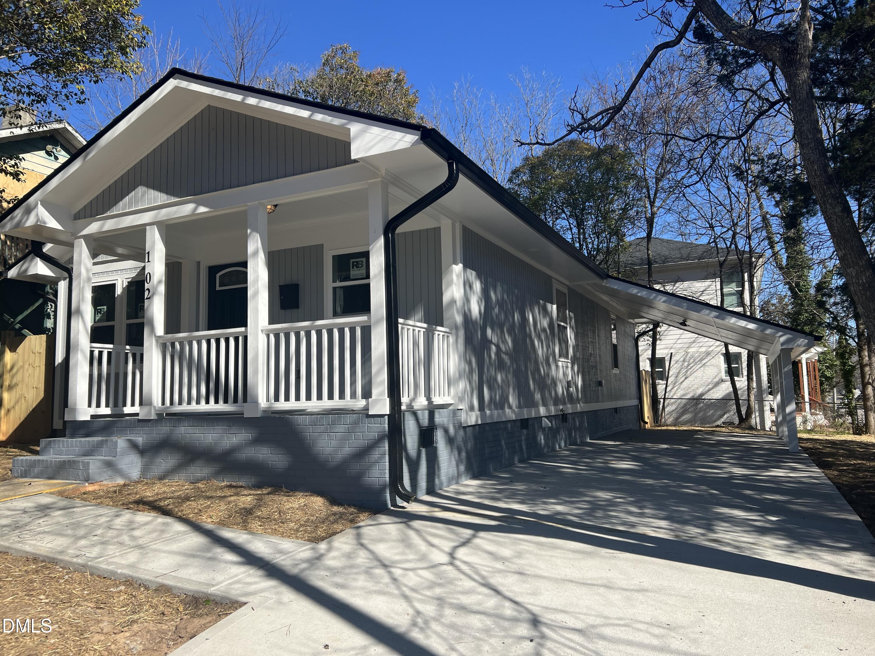 102 St Augustine Raleigh, NC 27610 - Photo 3 of 13 a front view of a house with a yard