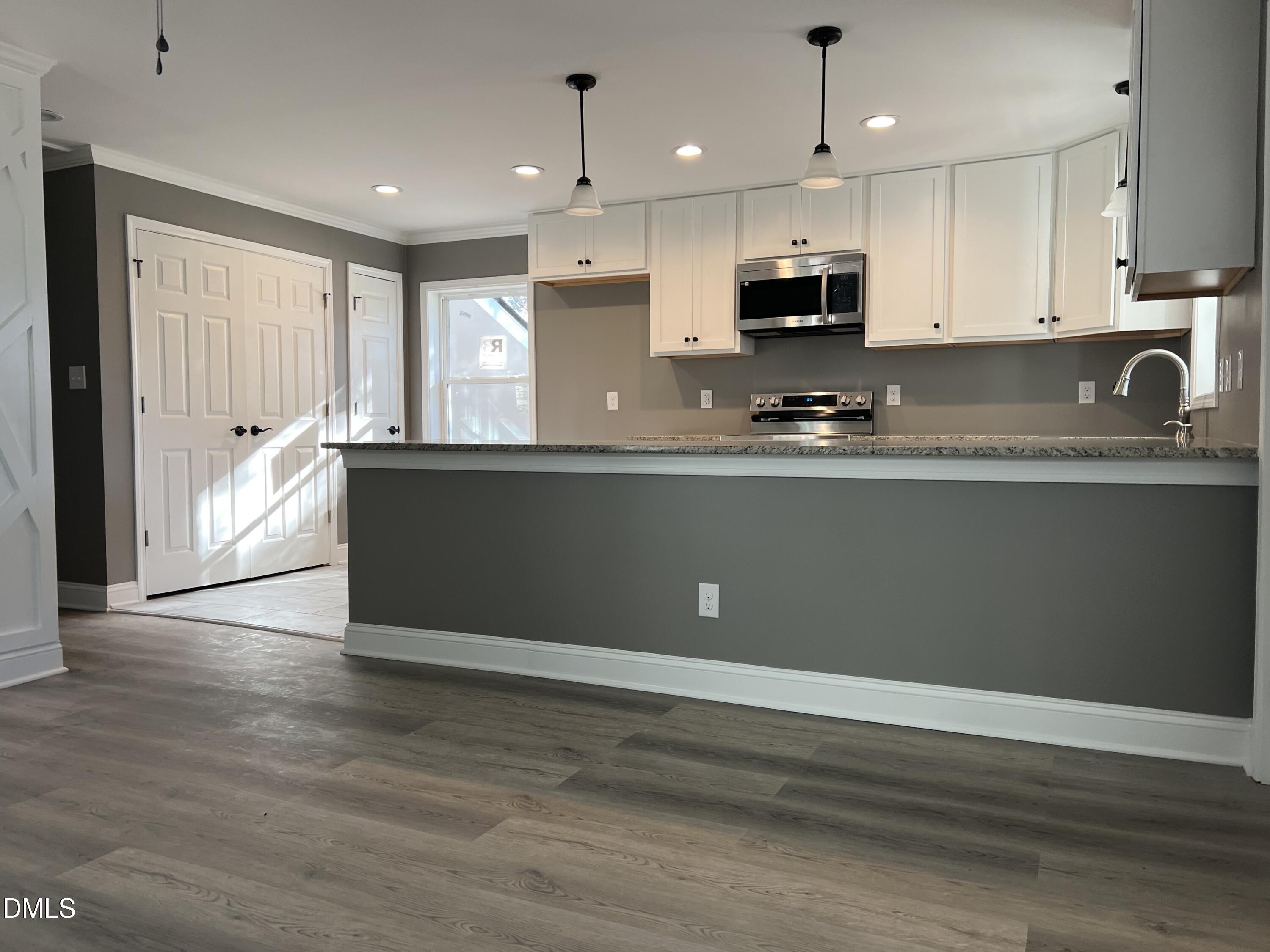 102 St Augustine Raleigh, NC 27610 - Photo 5 of 13 a view of kitchen with granite countertop stainless steel appliances and sink