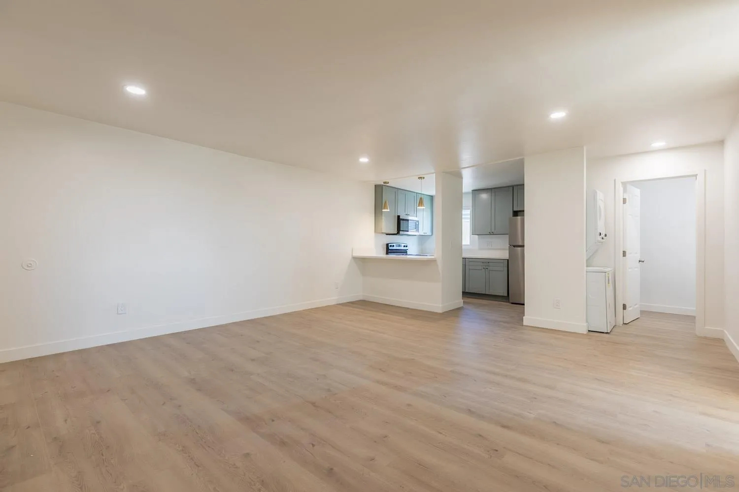 9249 Birch Street Spring Valley, CA 91977 - Photo 12 of 24 a view of empty room with kitchen and window