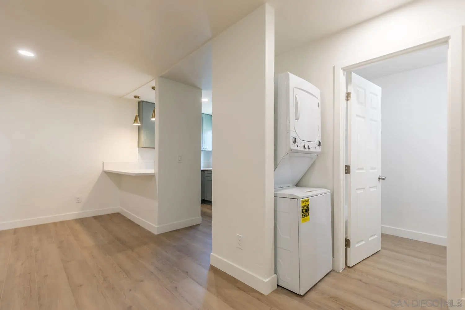 9249 Birch Street Spring Valley, CA 91977 - Photo 13 of 24 a view of walk in closet with wooden floor