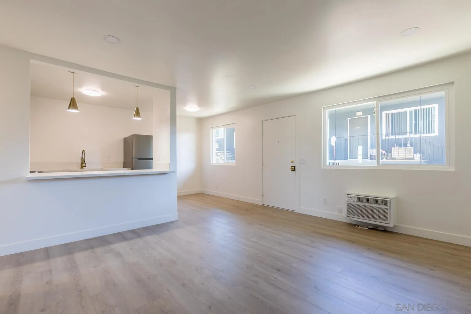 9249 Birch Street Spring Valley, CA 91977 - Photo 16 of 24 a view of kitchen and wooden floor