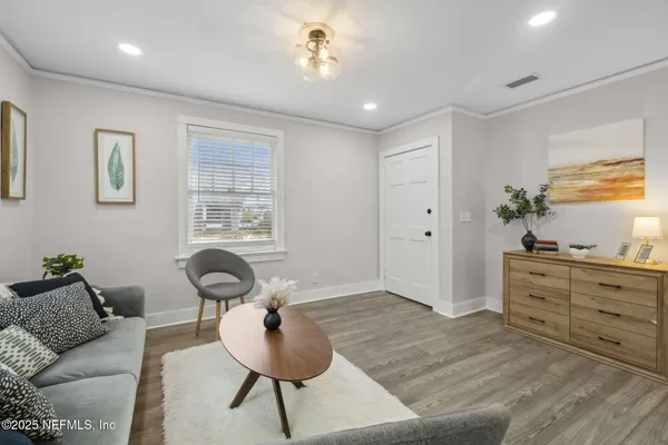 a living room with furniture and a window