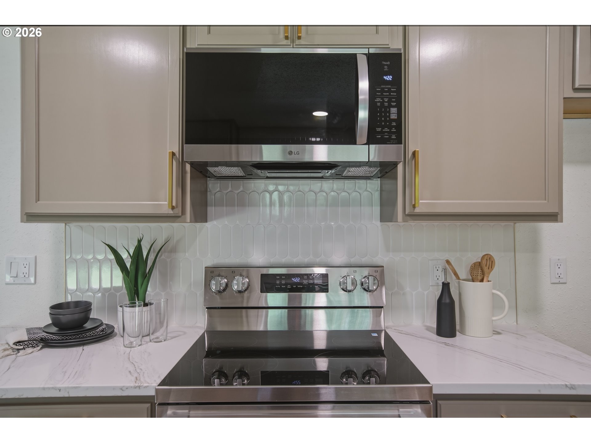 3455 Potter Street Eugene, OR 97405 - Photo 21 of 36 a kitchen with a stove and a microwave