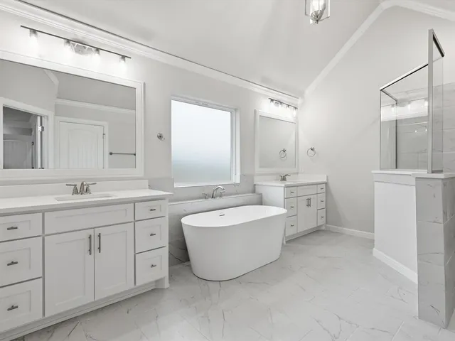 a bathroom with a bathtub shower sink and toilet