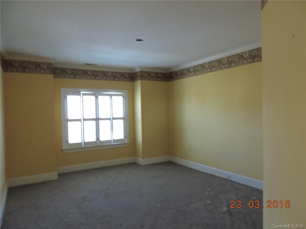 19213 Captains Watch Road Cornelius, NC 28031 - Photo 15 of 23 an empty room with a empty space and windows