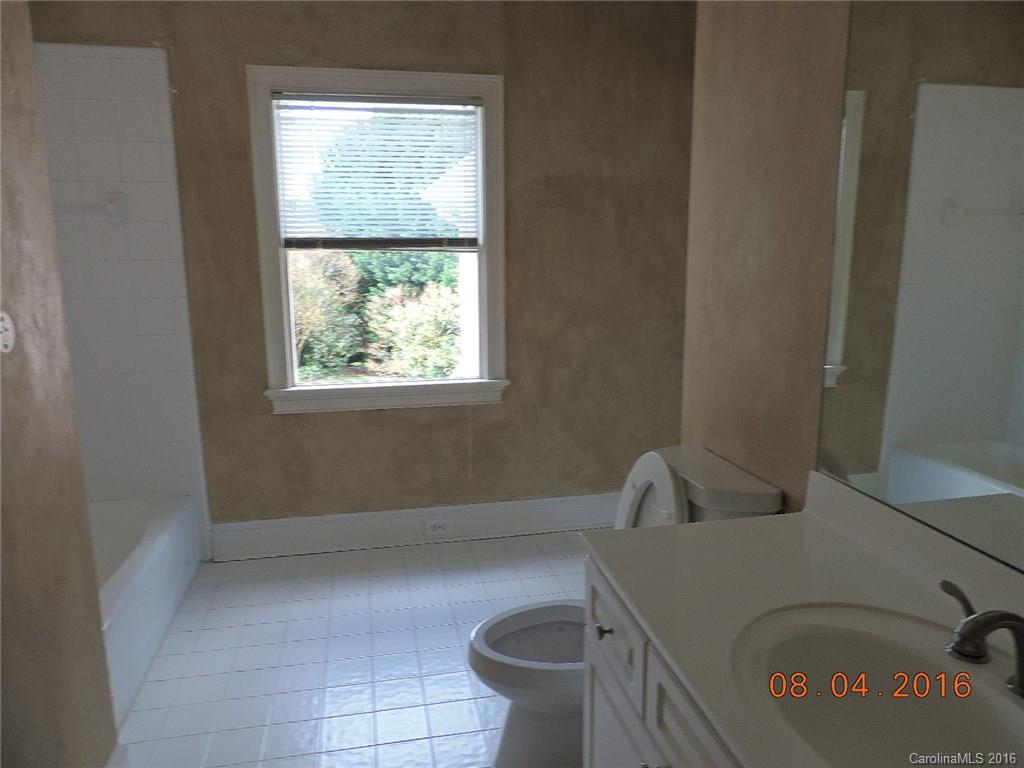 19213 Captains Watch Road Cornelius, NC 28031 - Photo 16 of 23 a bathroom with a toilet and a window