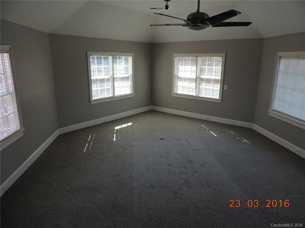 19213 Captains Watch Road Cornelius, NC 28031 - Photo 17 of 23 a view of an empty room with a window