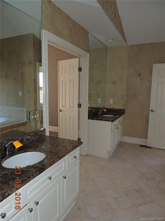 19213 Captains Watch Road Cornelius, NC 28031 - Photo 9 of 23 a bathroom with a granite countertop sink and a mirror