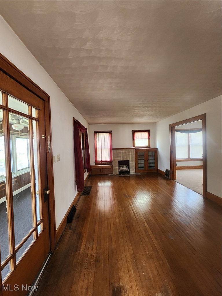 522 Columbus Avenue Northwest Canton, OH 44708 - Photo 6 of 16 Living room with gorgeous hardwood and fireplace.