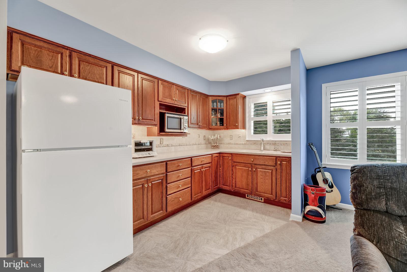 2316 Wilson Road White Hall, MD 21161 - Photo 22 of 37 a kitchen with stainless steel appliances granite countertop a refrigerator and a sink