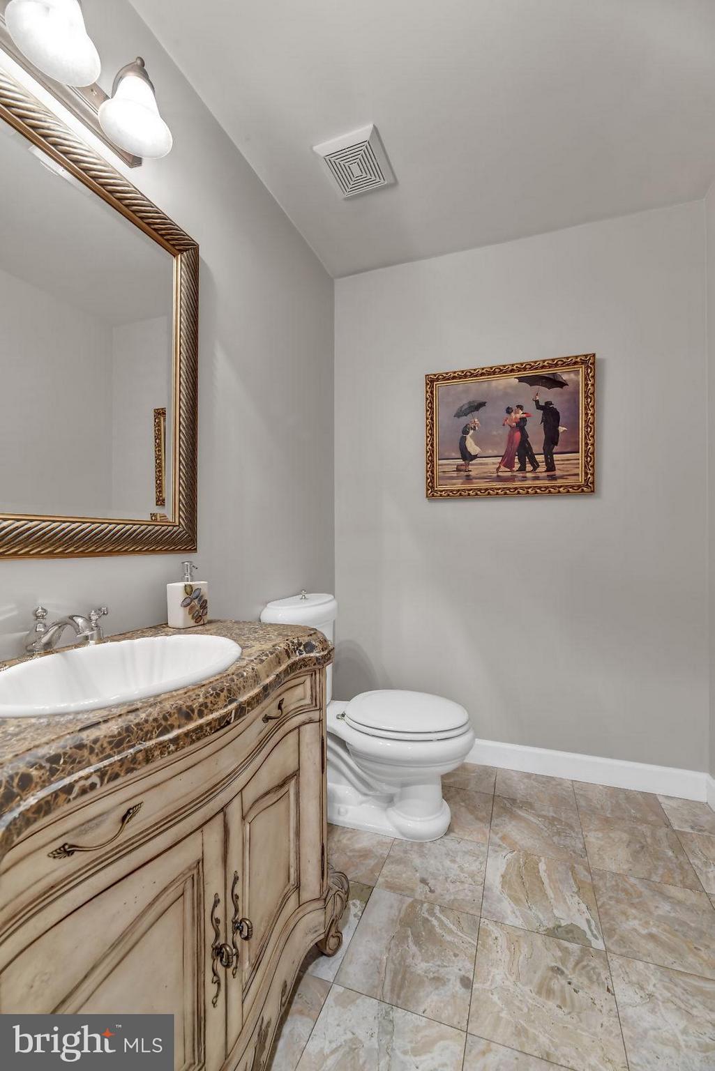 2316 Wilson Road White Hall, MD 21161 - Photo 23 of 37 a bathroom with a granite countertop sink mirror vanity and toilet