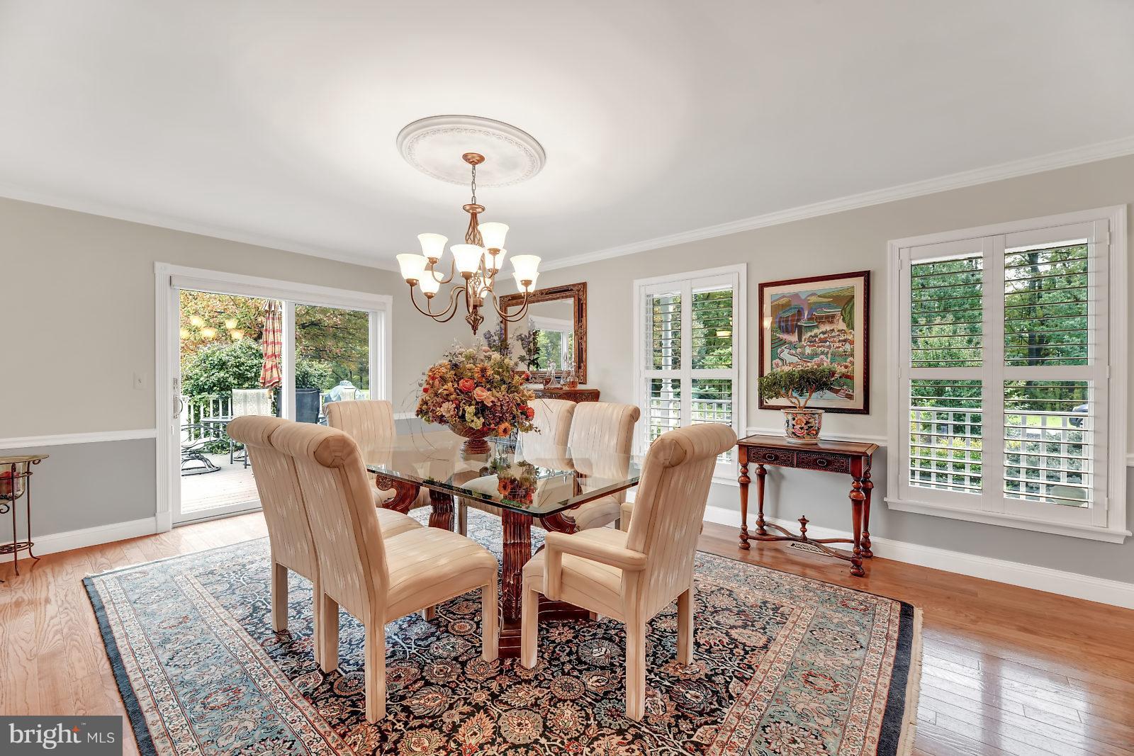 2316 Wilson Road White Hall, MD 21161 - Photo 6 of 37 a view of a dining room with furniture a chandelier and wooden floor