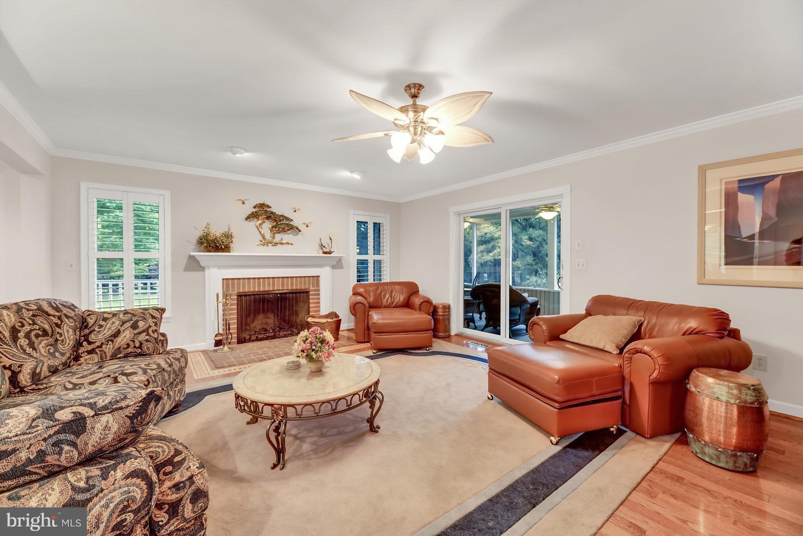 2316 Wilson Road White Hall, MD 21161 - Photo 8 of 37 a living room with furniture chandelier and a fireplace