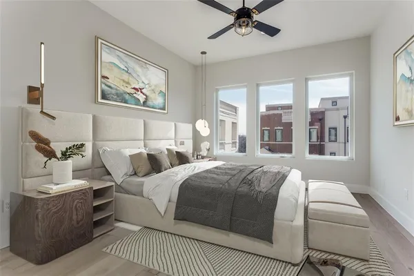 a bedroom with a large bed and a window