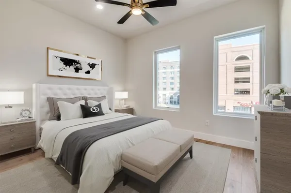 a bedroom with a bed and a window