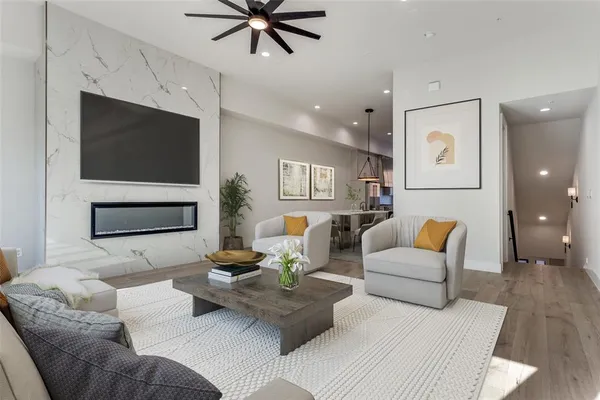 a living room with furniture and a flat screen tv