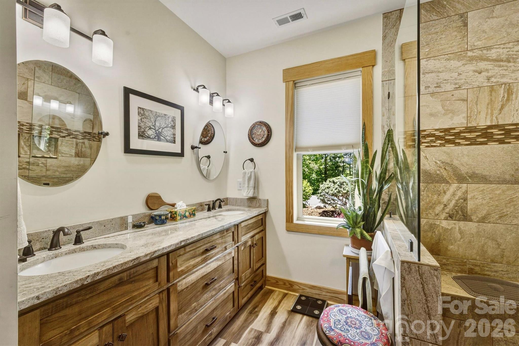 5564 Table View Lane Lenoir, NC 28645 - Photo 20 of 48 a bathroom with a double vanity sink and a mirror