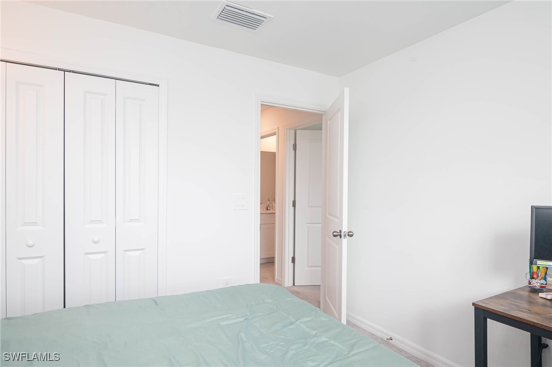12310 Dakota Ridge Place Lehigh Acres, FL 33974 - Photo 23 of 34 a view of a small space with wooden floor