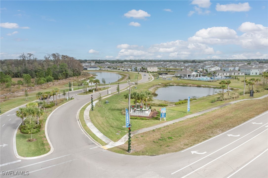 12310 Dakota Ridge Place Lehigh Acres, FL 33974 - Photo 32 of 34 a view of a swimming pool with a lake view