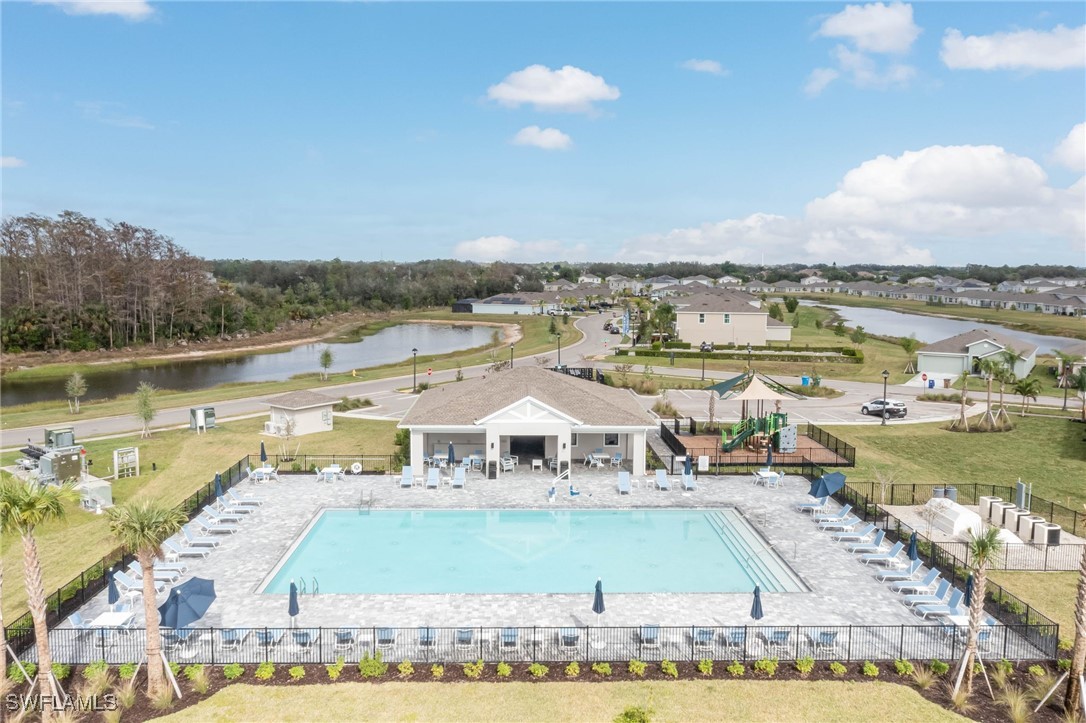 12310 Dakota Ridge Place Lehigh Acres, FL 33974 - Photo 33 of 34 a view of a swimming pool with an ocean view