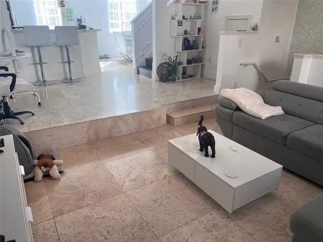 a living room with furniture and a table