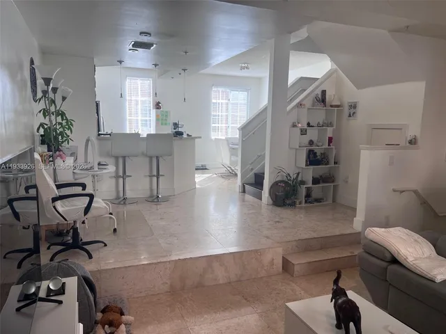 a living room with furniture and a view of living room